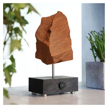 The specimen is displayed on a pole, which is fixed into a wooden block, embossed with the Museum logo. 