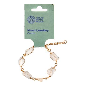 The gold-plated chain bracelet in its packaging. It has six rough-cut, white-coloured quartz beads.