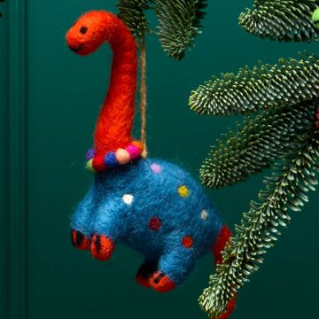 The orange Diplodocus wears a necklace of colourful baubles and a blue jumper with multicoloured dots on it.