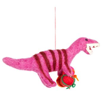 The pink body of the felt Velociraptor decoration has darker pink stripes on it and its teeth are white. It holds wrapped presents in its arms.