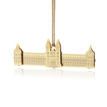 The front of the gold decoration is shaped like the Museum’s Waterhouse building. There are two towers in the centre above the door and one at either end. The gold hanging ribbon is attached in the centre.