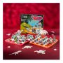 The Guess Who? boards and packaging, styled as if mid-game, with a red background and glow-in-the-dark dinosaurs surrounding the boards.