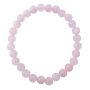 The Rose Quartz Round Bead Bracelet is on a white background. The circle of pale pink beads are equal in size and all shaped like small balls.