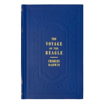 The hard front cover of the book is navy blue, with an ornate inlay design that frames the yellow text which says The Voyage of the Beagle, Charles Darwin.