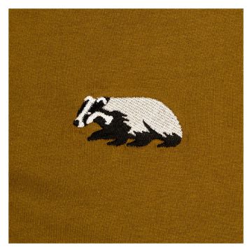 A close up of the embroidered badger showing its black and white body. 
