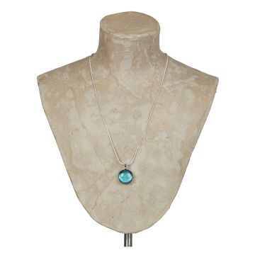 The Dichroic Glass Mini Pendant Necklace is displayed on a shoulder bust. The round pendant is bright blue and hangs at the bottom of a silver chain.