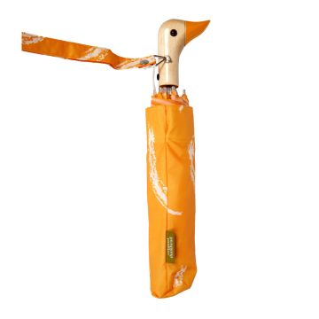 The umbrella is shown closed and in its orange and white cover. The wooden handle is in the shape of a duck head with a black eye and orange beak. The orange and white wrist band is attached to the duck's neck.