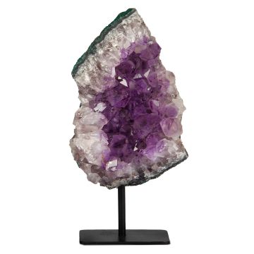 The amethyst is triangular in shape and displayed on a pole fixed to a stand. The amethyst’s purple middle is surrounded by a pale purple, almost white layer of crystal, encased in a dark edge. 
