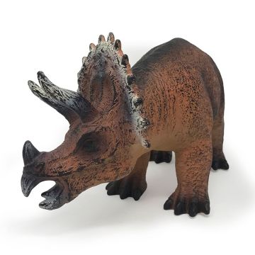  The Triceratops faces forward with its head turned to show the head and neck frill close up.