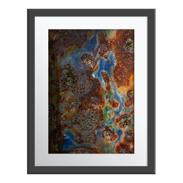 Taiga Tapestry Wall Print in a grey frame. An overhead shot of the swamp water meandering through rust-coloured moss and green and yellow grasses.