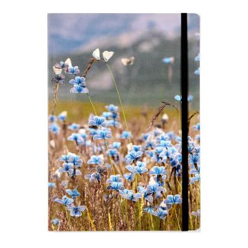 The notebook’s front cover is a photo of eros blue butterflies among alpine meadow vegetation. There is a black elastic strap on the right of the cover.