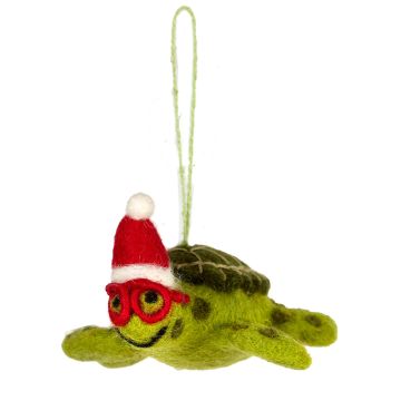 The light-green body of the turtle has a darker green shell and wears red goggles and a red and white Santa-style hat. It hangs from a green thread.