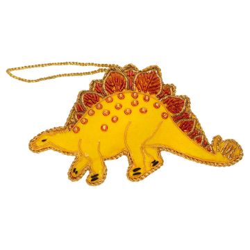 The yellow body of the Stegosaurus decoration is edged in gold thread. Its back and spine plates are covered in orange beading.