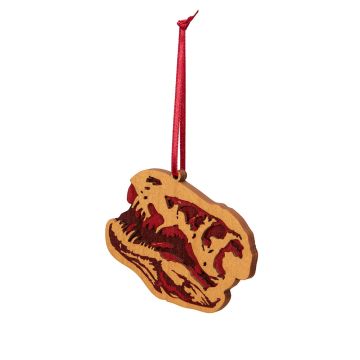 The wooden T. rex skull decoration hangs on a red ribbon.
