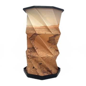 The lamp is expanded to its full height. The shape is a twisted octagonal column, with a picture of the dusty, rocky surface of Mars showing.