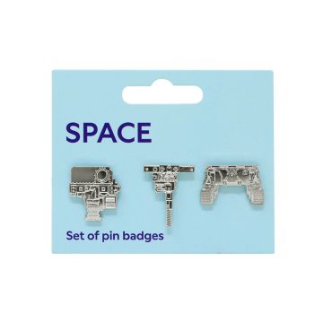 The set of three pin badges attached to their light blue card packaging, which has the word ‘Space’ in blue above them.