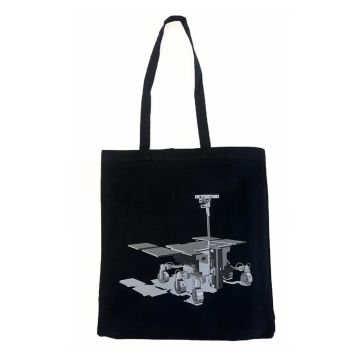 The black tote bag has a grey illustration of the Rosalind Franklin rover on it. Its distinctive features are its trolley-like wheels, solar panels and periscope-like camera.