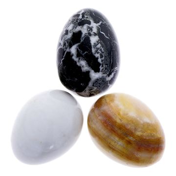 Three Mineral Eggs shown, one brown, one white, one black and white