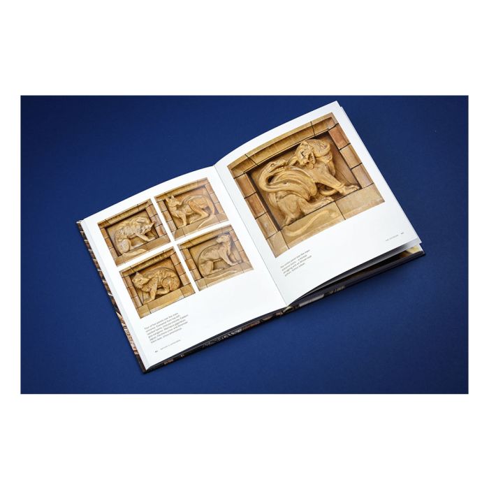 The inside pages of the book showing terracotta sculptures of animals. On the left are four photos in a grid of wolf-like creatures. On the right is one image of a wildcat with a snake coiled around its back legs.