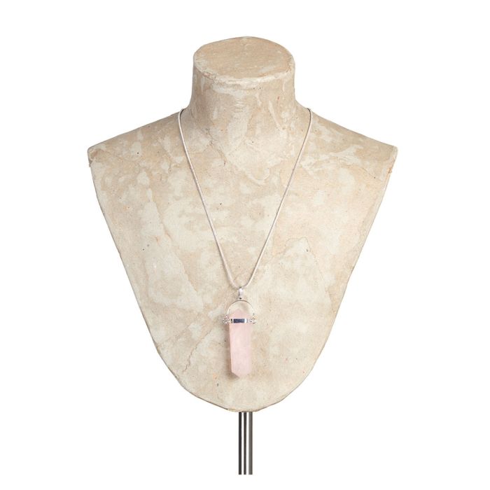 The Rose Quartz Smooth Point Pendant Necklace displayed on a cream-coloured shoulder bust.