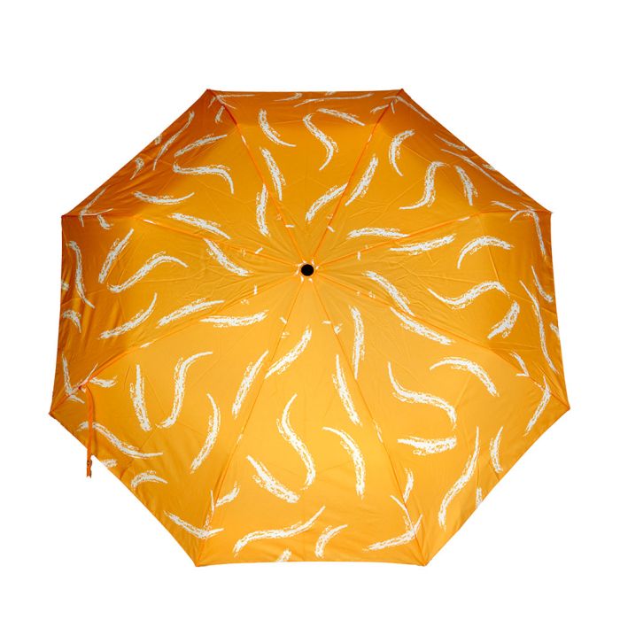 An overhead photo of the orange umbrella canopy opened, showing the white s-shaped pattern.